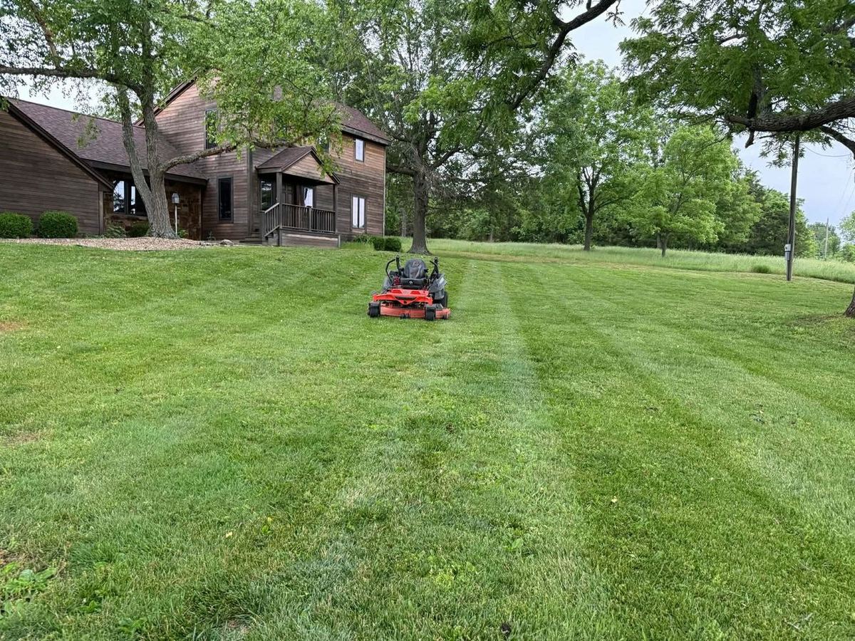 Zero-turn mower working a large open property