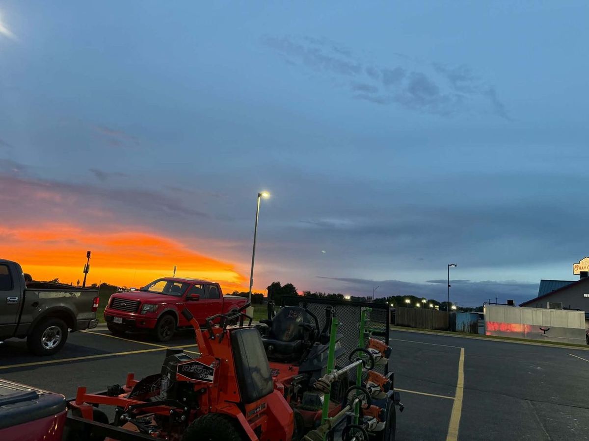 Mower trailer loaded up at sunset after a day of routes